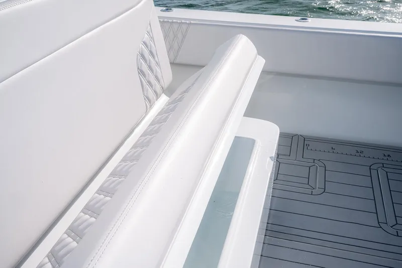Slide: The Image of White seating on a 2020 Contender 44 ST boat, featuring sleek design and ocean backdrop. - 15