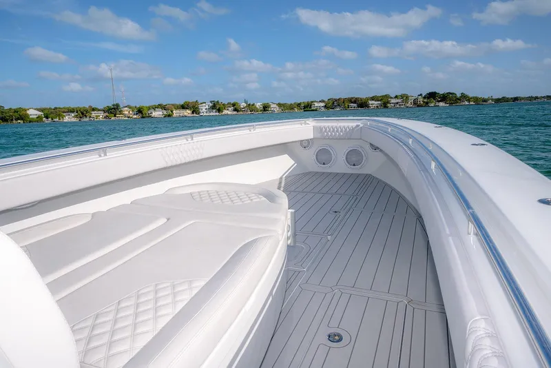 Slide: The Image of 2020 Contender 44 ST boat interior with white seating and ocean view. - 16