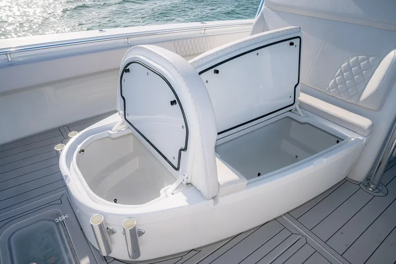 Slide: The Image of 2020 Contender 44 ST boat with open storage compartment on deck. - 18