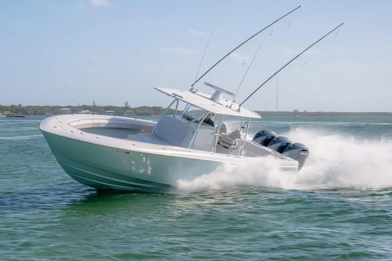 Slide: The Image of 2020 Contender 44 ST boat speeding on water with fishing rods and powerful engines. - 22