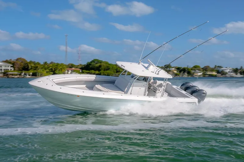 Slide: The Image of 2020 Contender 44 ST boat cruising swiftly on open water, showcasing powerful engines. - 26