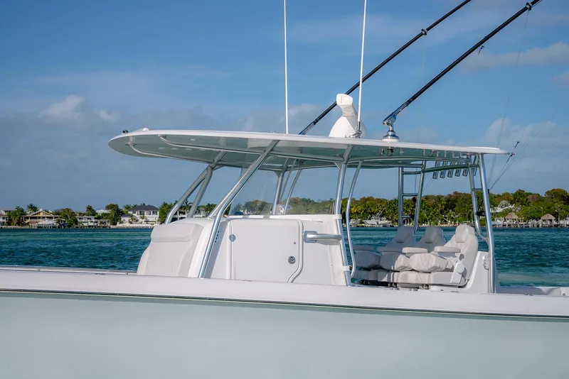 Slide: The Image of 2020 Contender 44 ST boat on water, featuring sleek design and spacious seating. - 27