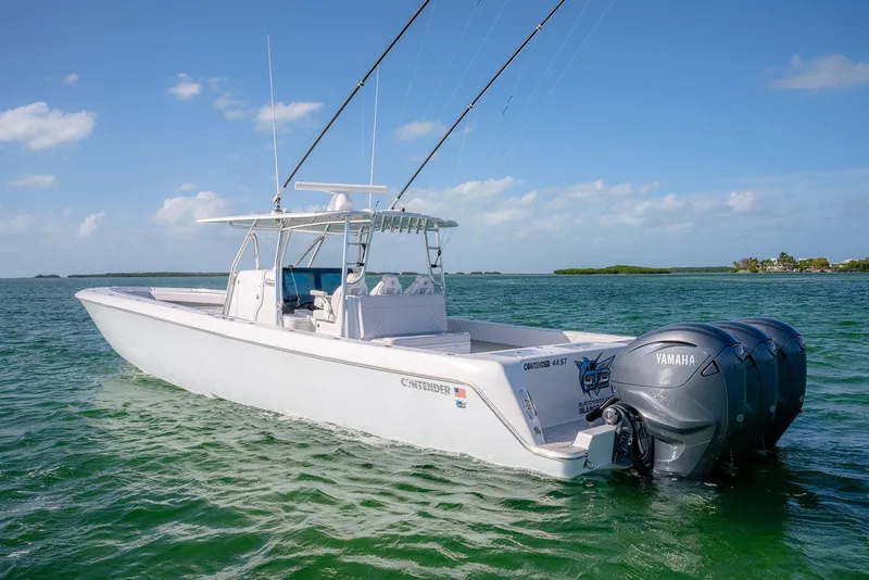 Slide: The Image of 2020 Contender 44 ST boat with Yamaha engines on open water under blue sky. - 28