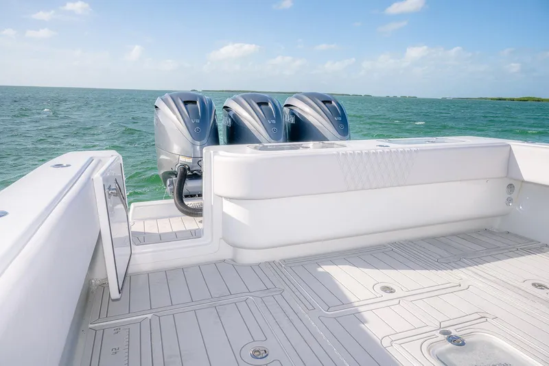 Slide: The Image of 2020 Contender 44 ST boat with triple outboard engines on open sea. - 31