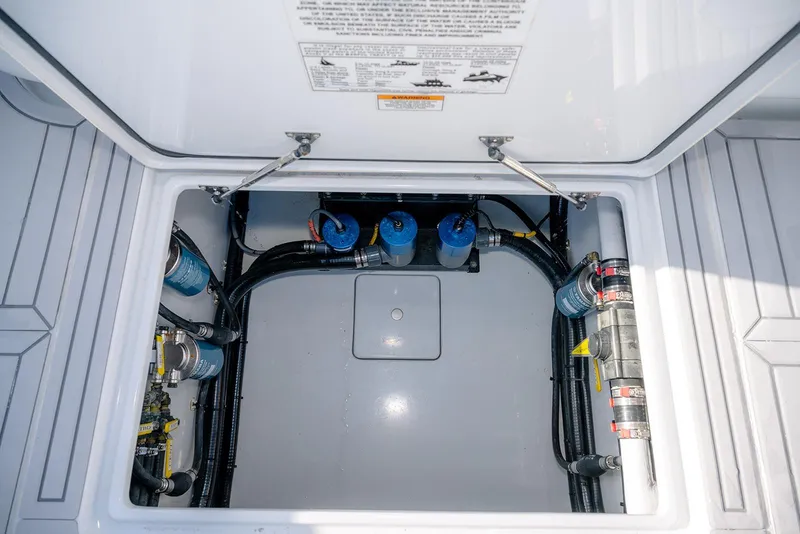 Slide: The Image of 2020 Contender 44 ST boat compartment with visible wiring and components. - 34