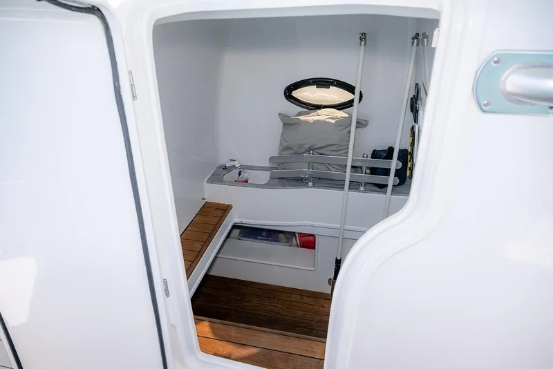 Slide: The Image of 2020 Contender 44 ST cabin interior with wooden flooring and seating. - 37