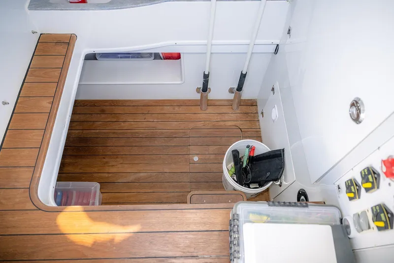 Slide: The Image of 2020 Contender 44 ST boat interior with wooden deck and fishing gear. - 38