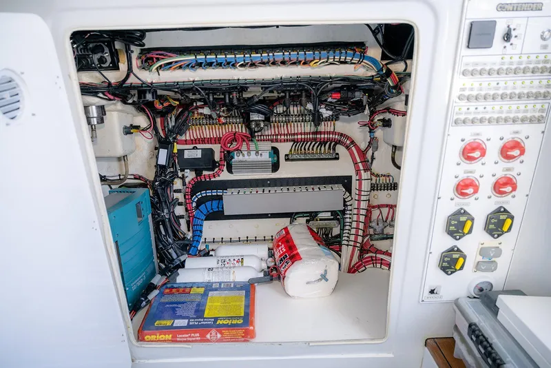 Slide: The Image of Electrical panel and wiring inside a 2020 Contender 44 ST boat. - 40