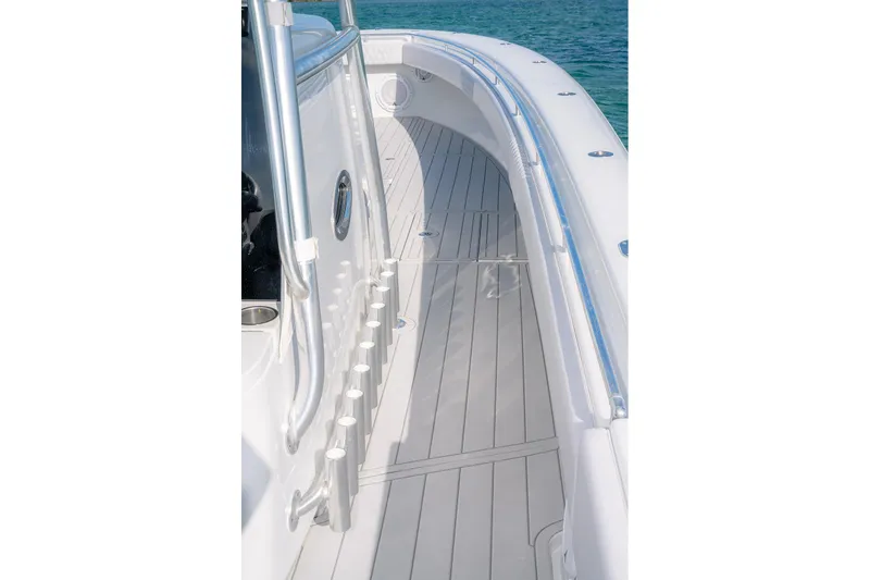 Slide: The Image of 2020 Contender 44 ST boat deck with rod holders and sleek design. - 45