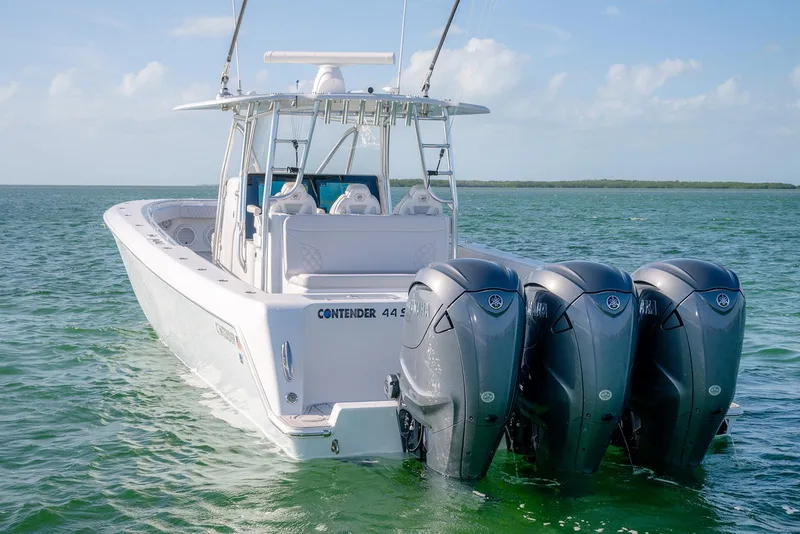 Slide: The Image of 2020 Contender 44 ST boat with triple outboard engines on open water. - 8