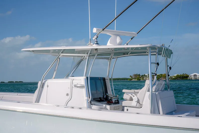 Slide: The Image of 2020 Contender 44 ST boat on water, featuring sleek design and modern amenities. - 9