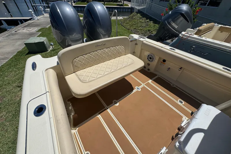 Slide: The Image of 2015 Chris-Craft Catalina 26 boat interior with seating and dual Yamaha engines. - 14