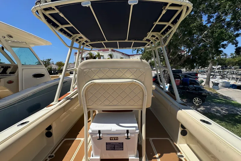 Slide: The Image of 2015 Chris-Craft Catalina 26 boat interior with seating and Yeti cooler. - 15