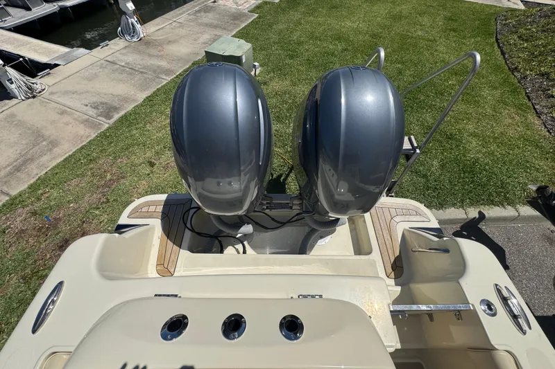 Slide: The Image of 2015 Chris-Craft Catalina 26 boat with dual outboard motors at dockside. - 16