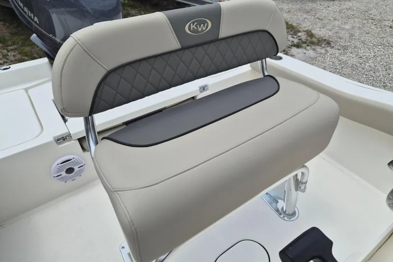 Slide: The Image of 2026 Key West 179 FS boat seat with beige and black upholstery. - 10