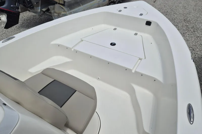 Slide: The Image of Interior view of 2026 Key West 179 FS boat, featuring seating and storage compartments. - 11