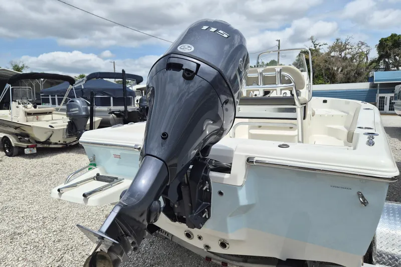 Slide: The Image of 2026 Key West 179 FS boat with Yamaha outboard motor, displayed outdoors on gravel. - 15
