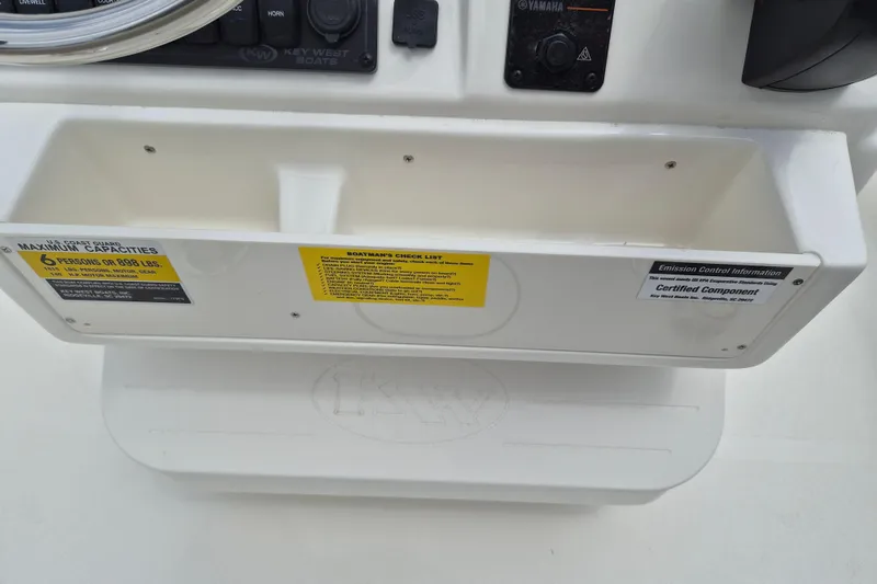 Slide: The Image of Control panel of 2026 Key West 179 FS boat with capacity and emission labels. - 9