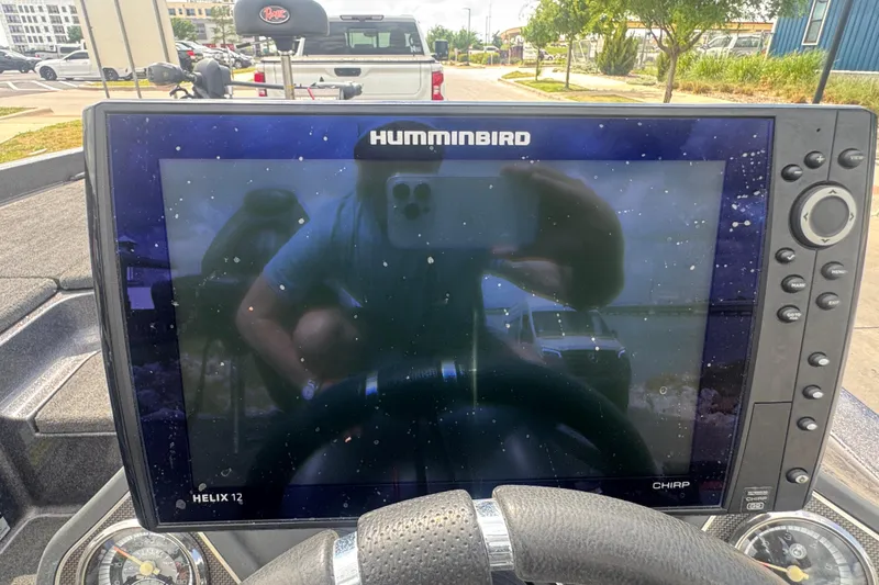 Slide: The Image of Humminbird Helix 12 fishfinder on 2010 Ranger Z521 Comanche boat dashboard. - 11
