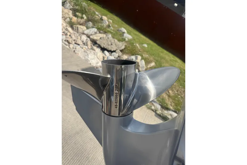 Slide: The Image of Propeller of 2010 Ranger Z521 Comanche boat, shiny metal finish, outdoors. - 14
