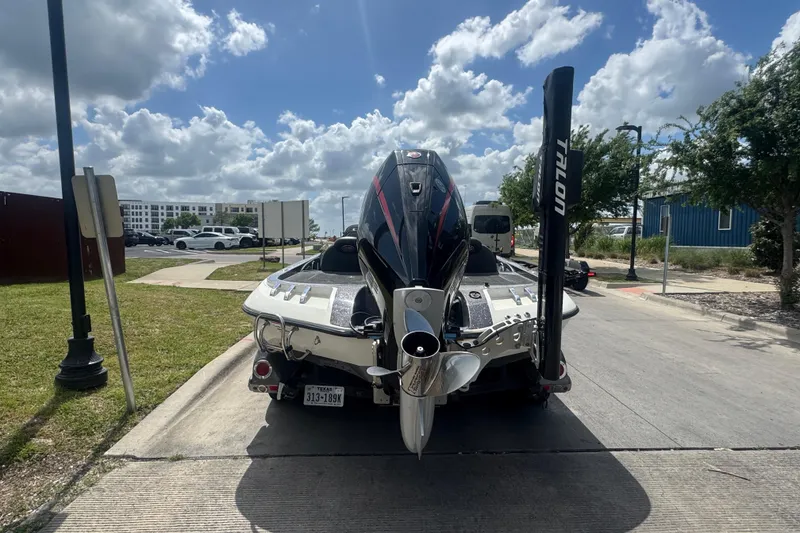 Slide: The Image of 2010 Ranger Z521 Comanche boat on trailer, parked on a sunny street. - 3