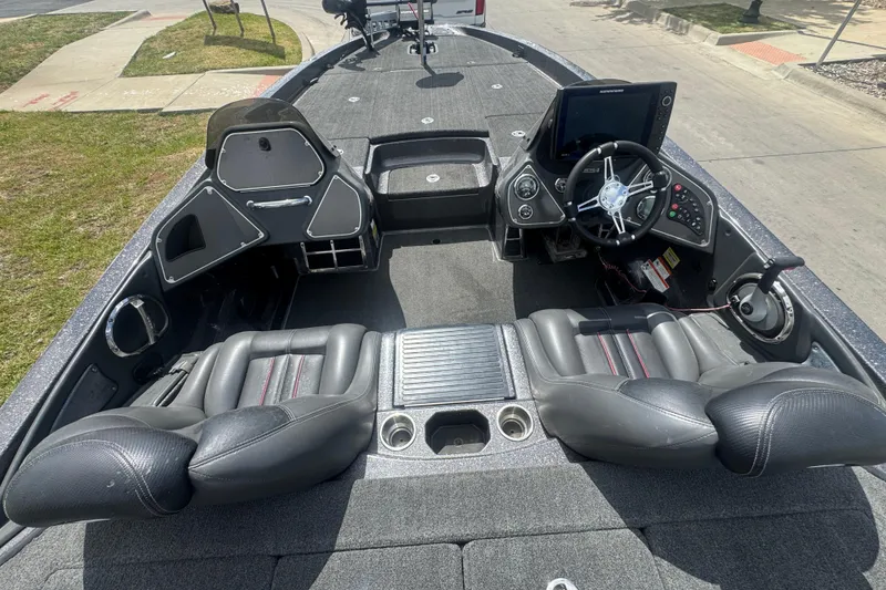 Slide: The Image of 2010 Ranger Z521 Comanche boat interior with steering wheel and seating. - 6
