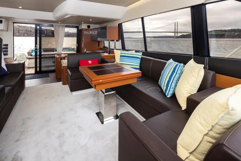Slide: The Image of Luxurious interior of 2017 Prestige 560 yacht with elegant seating and scenic water views. - 16