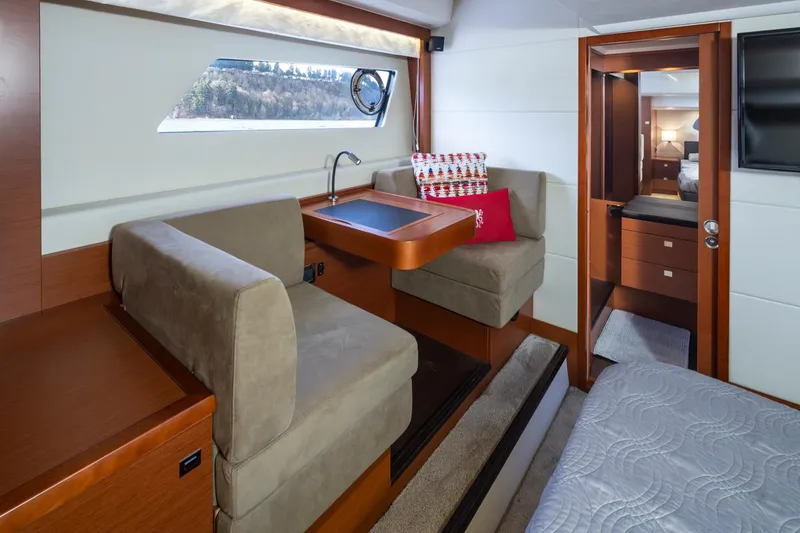 Slide: The Image of Luxurious interior of a 2017 Prestige 560 yacht with cozy seating and elegant decor. - 24