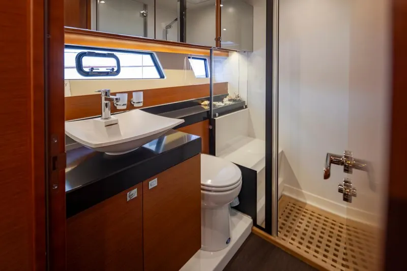 Slide: The Image of Luxurious bathroom in 2017 Prestige 560 yacht with modern fixtures and wooden accents. - 34