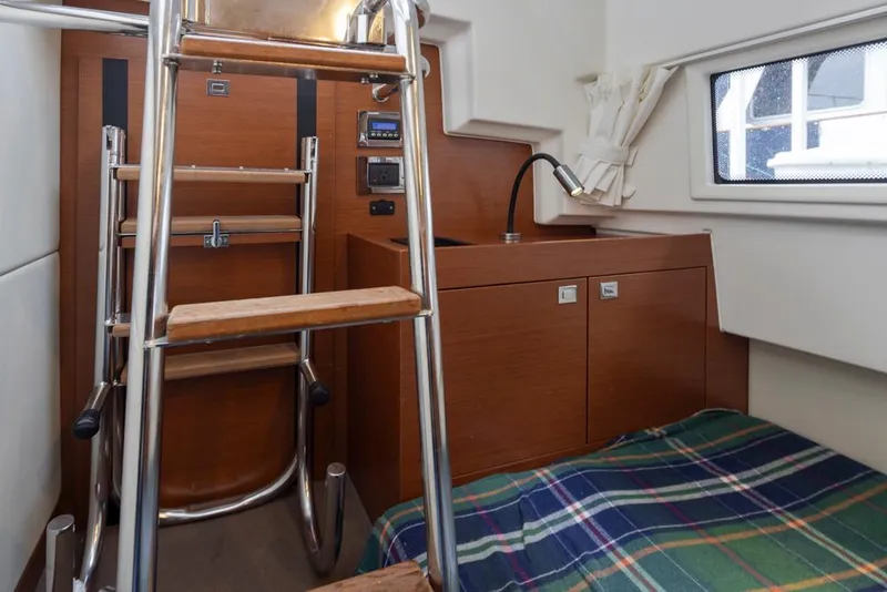 Slide: The Image of Interior of 2017 Prestige 560 yacht with wooden ladder and compact cabin space. - 40