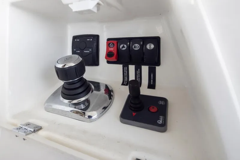 Slide: The Image of Control panel of a 2017 Prestige 560 yacht with joystick and switches. - 47