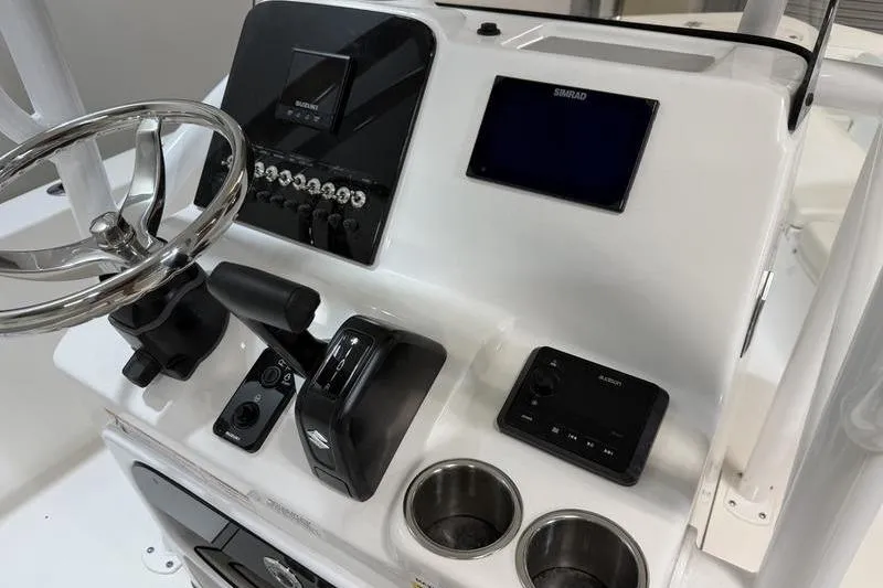 Slide: The Image of 2026 Sea Pro 202 Center Console dashboard with steering wheel and electronic controls. - 10
