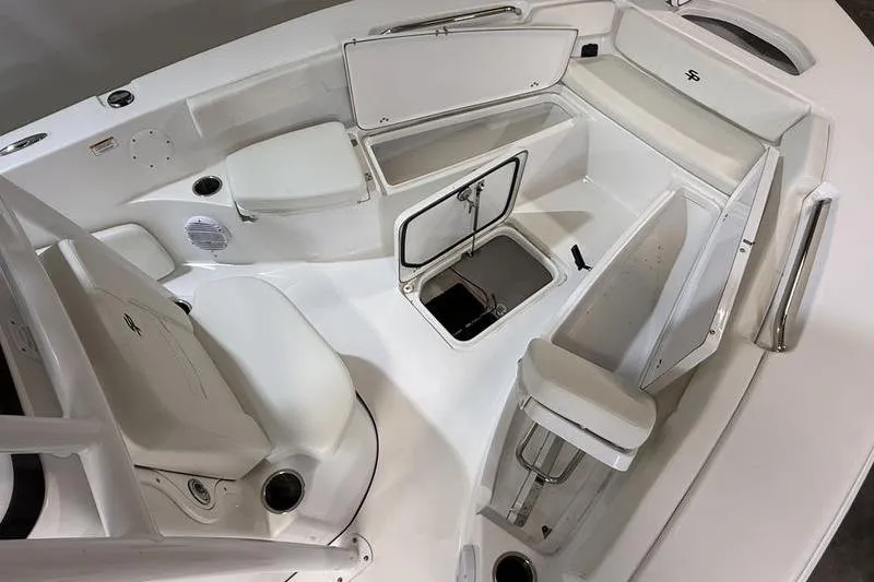 Slide: The Image of 2026 Sea Pro 202 Center Console boat interior with open storage compartments. - 16