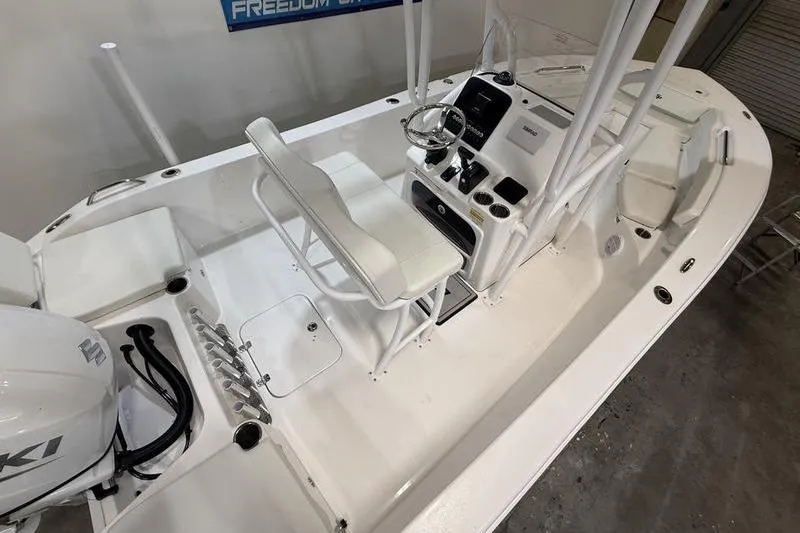 Slide: The Image of 2026 Sea Pro 202 Center Console boat interior with steering wheel and seating. - 4