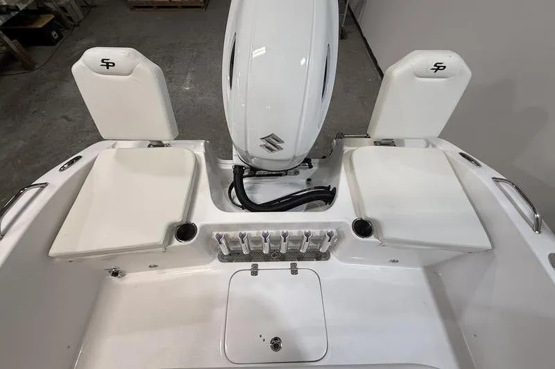 Slide: The Image of 2026 Sea Pro 202 Center Console boat interior with engine and seating. - 5