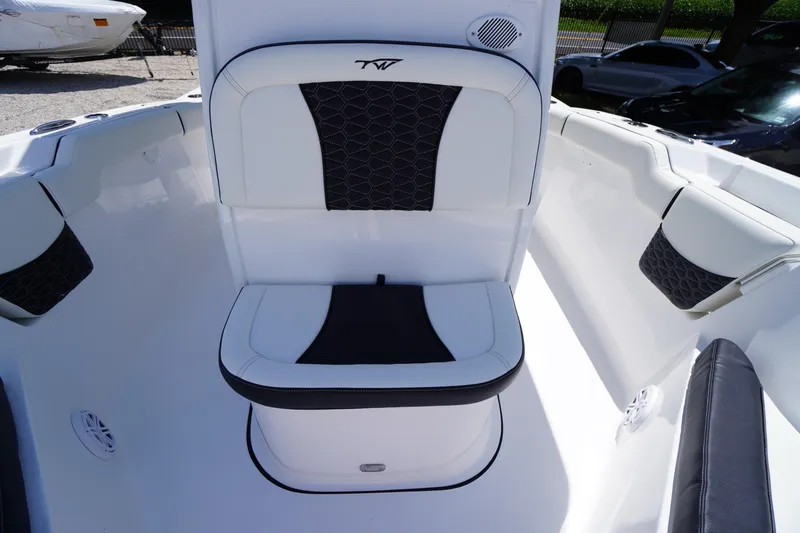 Slide: The Image of 2026 Tidewater 232 LXF boat interior with cushioned seating and modern design. - 17
