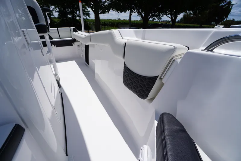 Slide: The Image of 2026 Tidewater 232 LXF boat interior with sleek white and black seating design. - 18