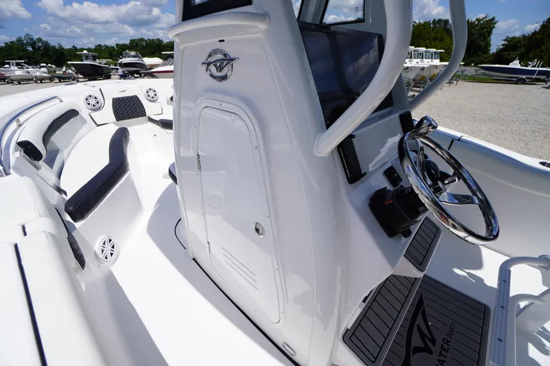 Slide: The Image of 2026 Tidewater 232 LXF boat interior with sleek design and modern steering console. - 20