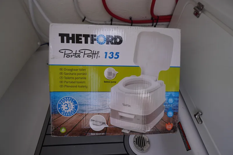 Slide: The Image of Thetford Porta Potti 135 portable toilet box inside Tidewater 232 LXF boat, 2026 model. - 24