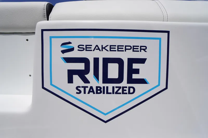 Slide: The Image of 2026 Tidewater 232 LXF boat featuring Seakeeper Ride stabilization logo. - 3