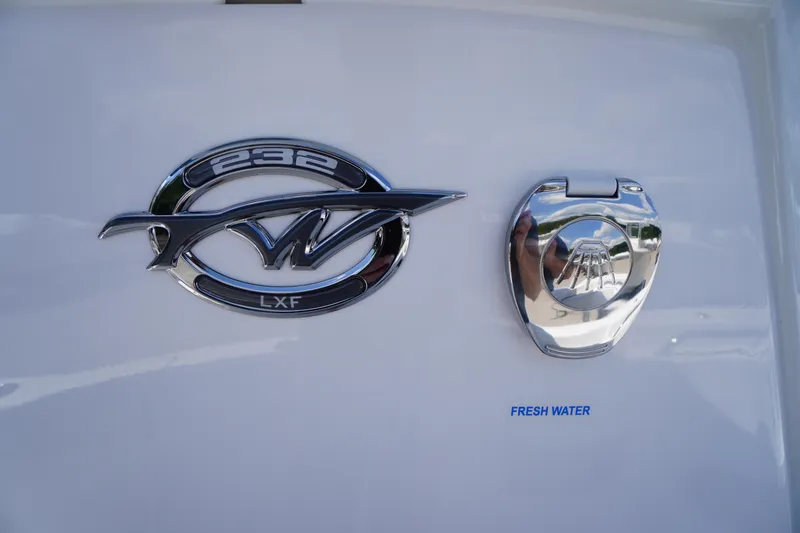 Slide: The Image of 2026 Tidewater 232 LXF boat emblem and fresh water access point. - 32