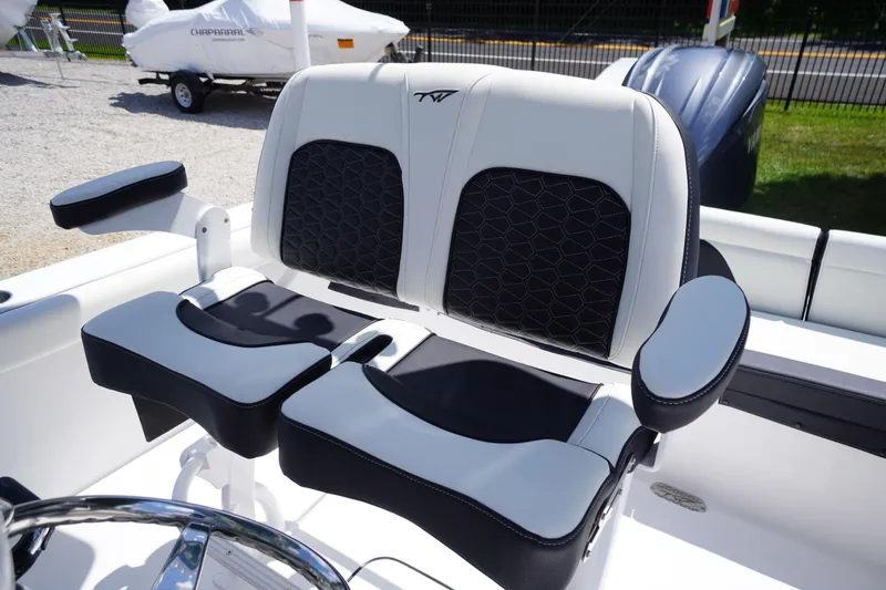Slide: The Image of 2026 Tidewater 232 LXF boat seating with black and white upholstery, showcasing modern design. - 36