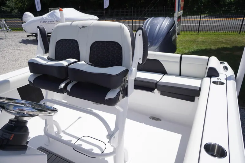 Slide: The Image of 2026 Tidewater 232 LXF boat interior with dual seats and steering wheel. - 41