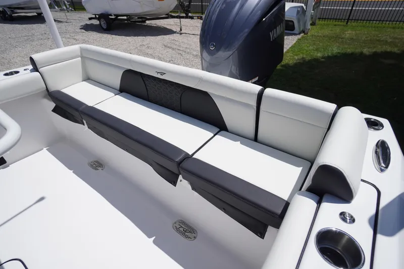 Slide: The Image of 2026 Tidewater 232 LXF boat interior with cushioned seating and Yamaha engine. - 46