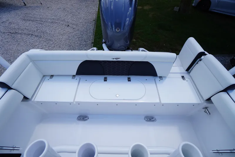 Slide: The Image of 2026 Tidewater 232 LXF boat interior with seating and storage compartments. - 48