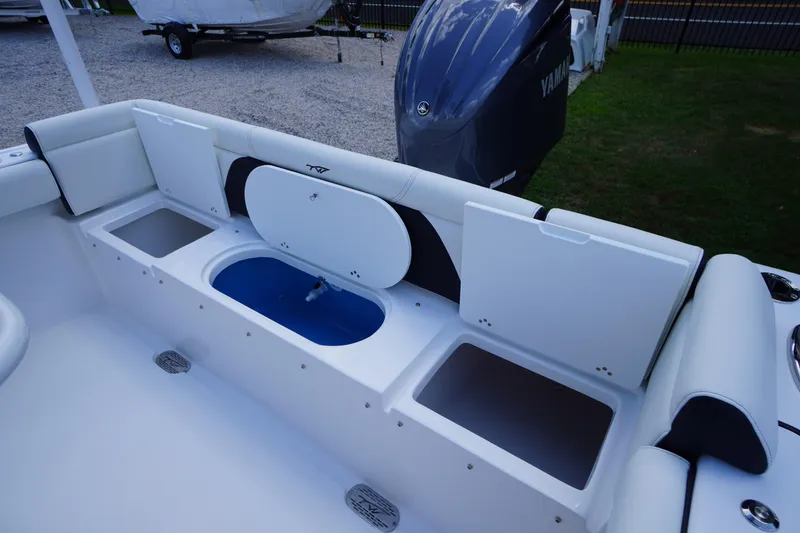 Slide: The Image of 2026 Tidewater 232 LXF boat interior with storage compartments and Yamaha engine. - 49