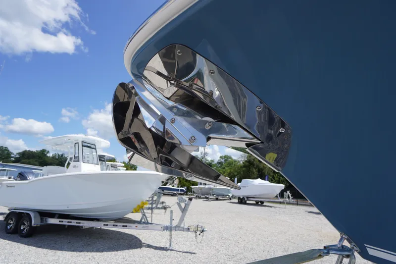 Slide: The Image of 2026 Tidewater 232 LXF boat with stainless steel anchor, displayed outdoors on a sunny day. - 5