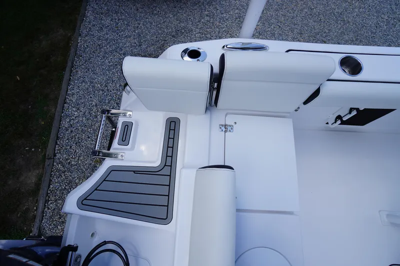 Slide: The Image of 2026 Tidewater 232 LXF boat interior with seating and swim platform. - 57