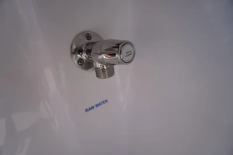 Slide: The Image of Chrome raw water outlet on 2026 Tidewater 232 LXF boat. - 58