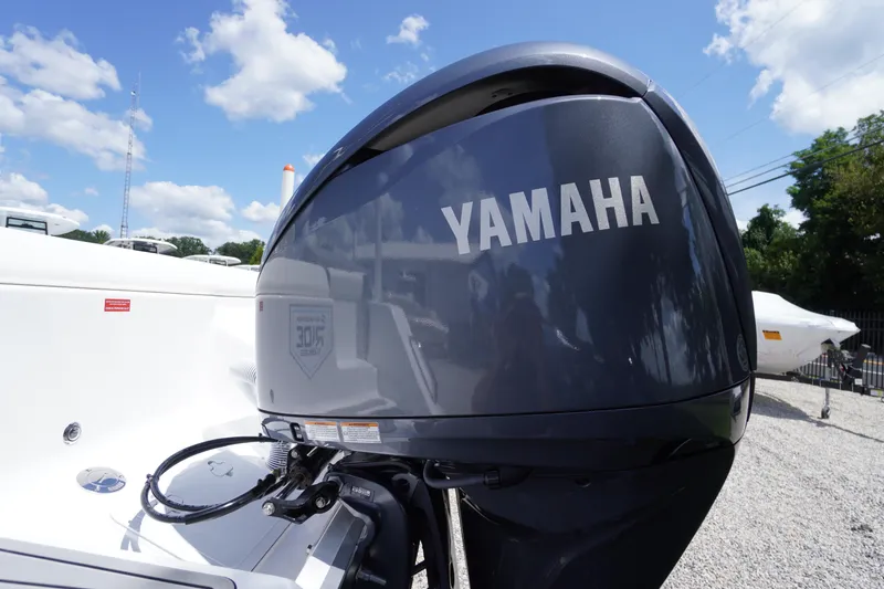 Slide: The Image of 2026 Tidewater 232 LXF boat with Yamaha outboard motor under a clear blue sky. - 77
